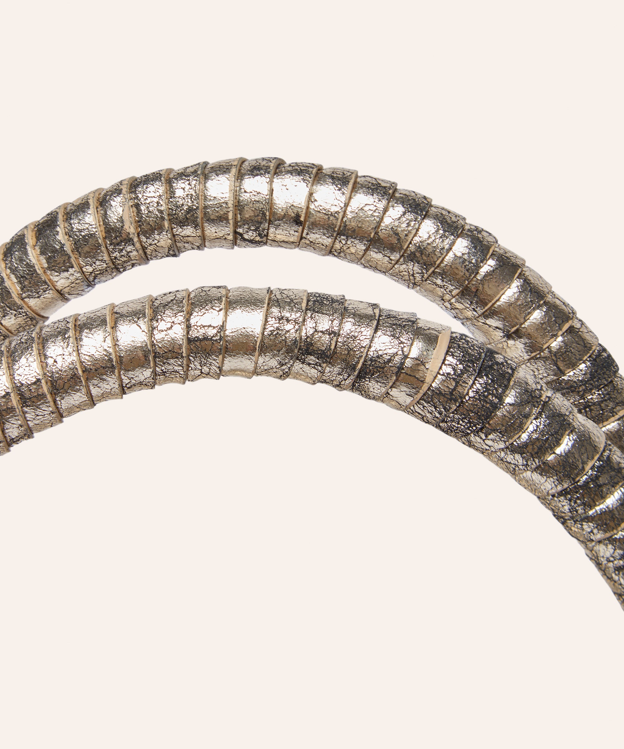 KUN HONG the CHUA collection Handbags Mother Satchel Daughter Mini Close-up of metallic wrapped leather handles on a light background