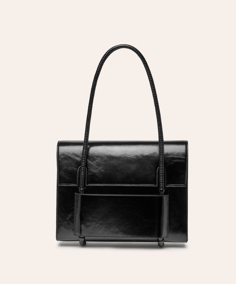 KUN HONG the CHUA collection Handbags Mother Satchel Daughter Mini  Black Lacquer Black handbag with a textured surface on a light beige background