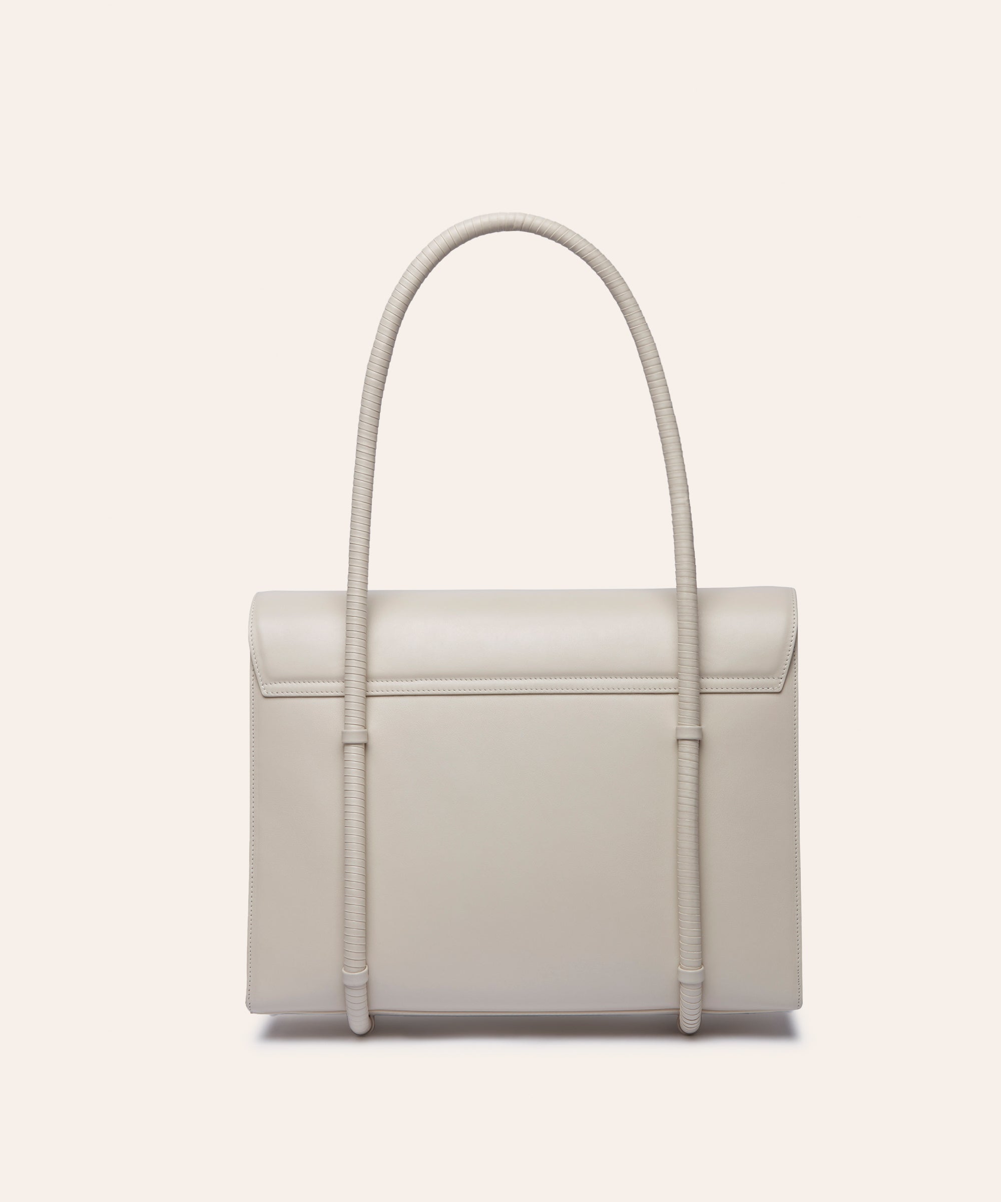 KUN HONG the CHUA collection Handbags Mother Satchel Daughter Mini in Colorway Pearl White handbag with leather wrapped handle on a light beige background